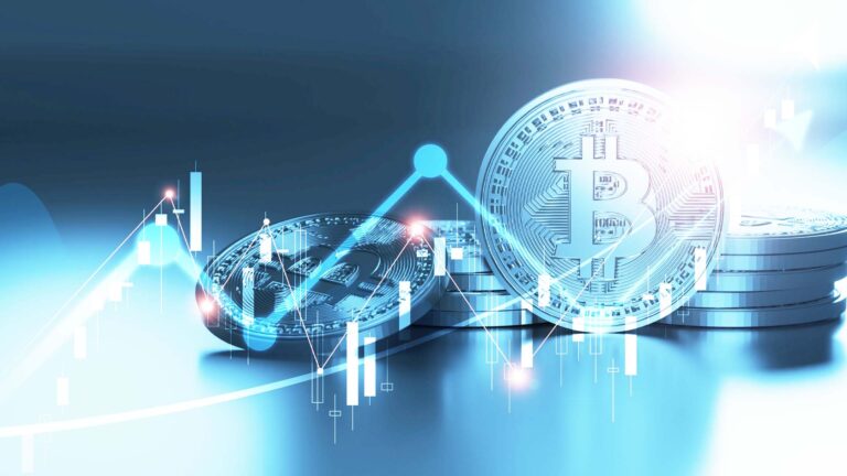 Bitcoin coins with financial charts representing cryptocurrency taxation in Croatia.