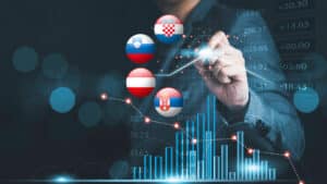 Business growth chart with flags of Croatia, Slovenia, Austria and Serbia representing a comparison of tax systems.